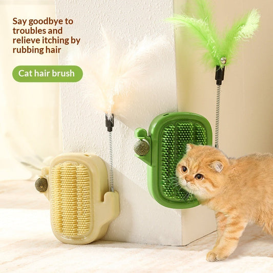 A golden cat beside green and cream cactus-shaped CactiRub brushes with spring-mounted feather teasers.